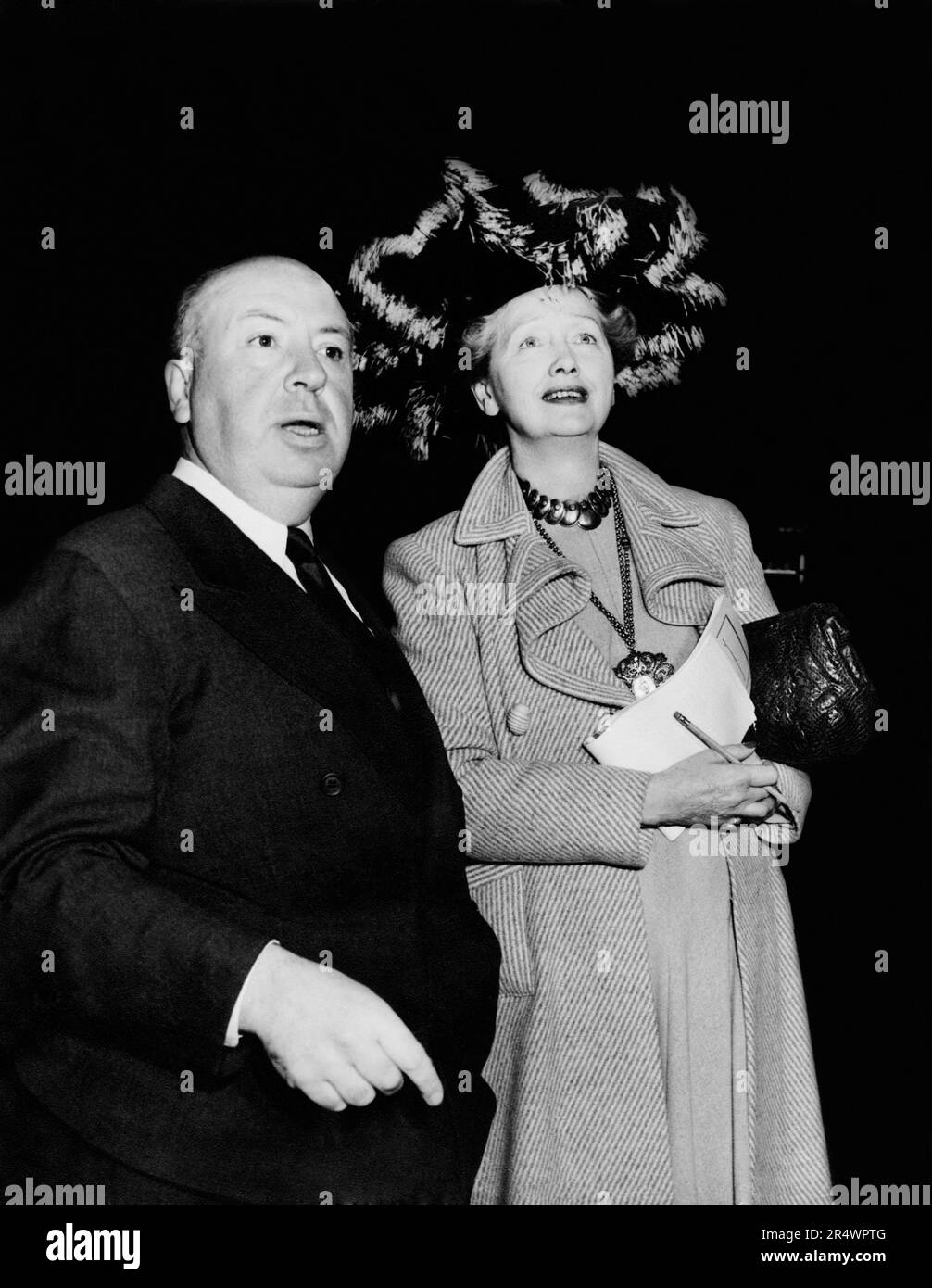 Alfred Hitchcock, Hedda Hopper attending a Hollywood party. Stock Photo