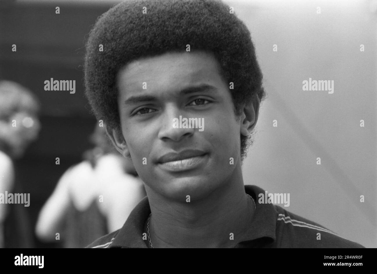 Portrait of French tennis player Yannick Noah in the stands of the French Open in May 1980. Stock Photo