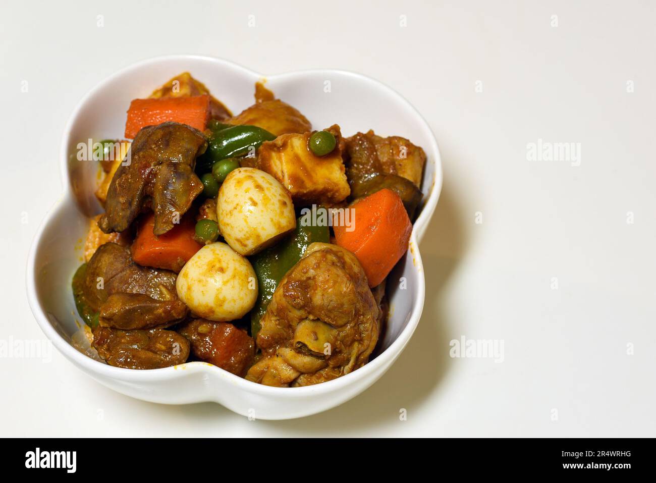 Chicken afritada with liver - a Filipino dish. Stock Photo