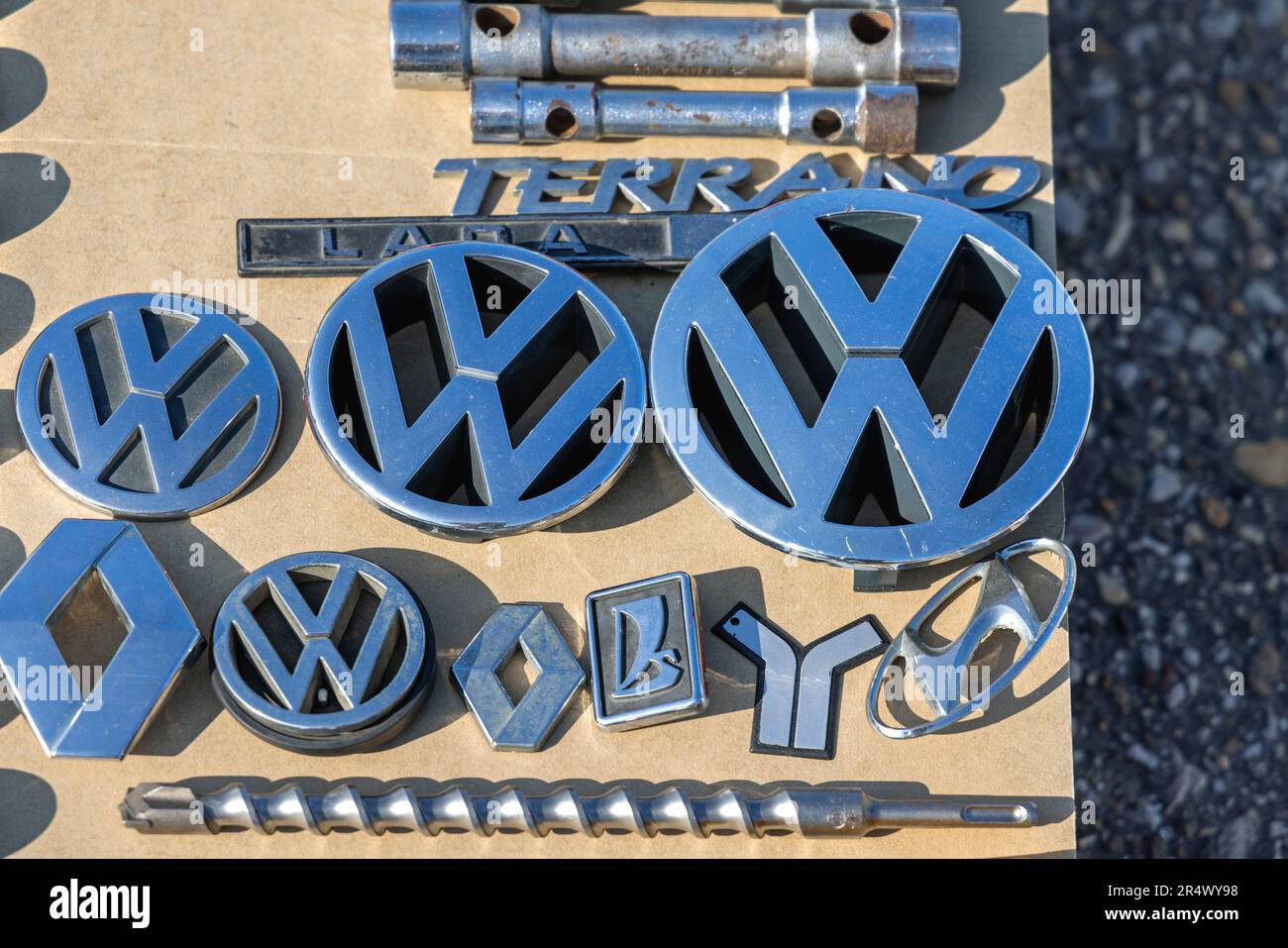 Belgrade, Serbia - May 06, 2023: Second Hand Car Emblems for Sale Volkswagen Renault Lada Hyundai Yugo VW at Flea Market. Stock Photo