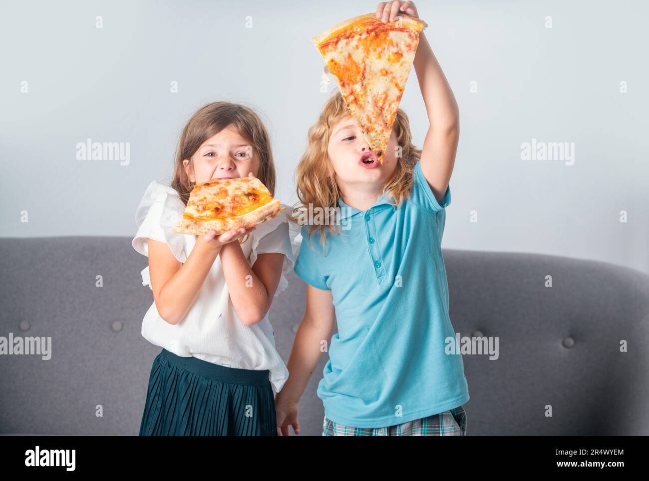 Pizza and kids, slices pizza in kids hand. Children eating tasty fast ...