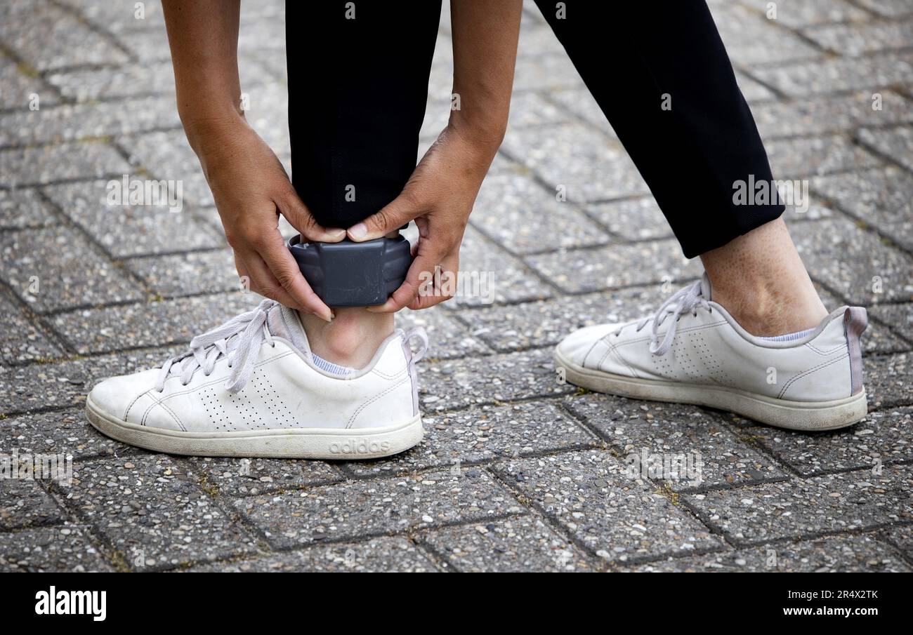 ILLUSTRATION An electronic ankle bracelet. Using electronic detention