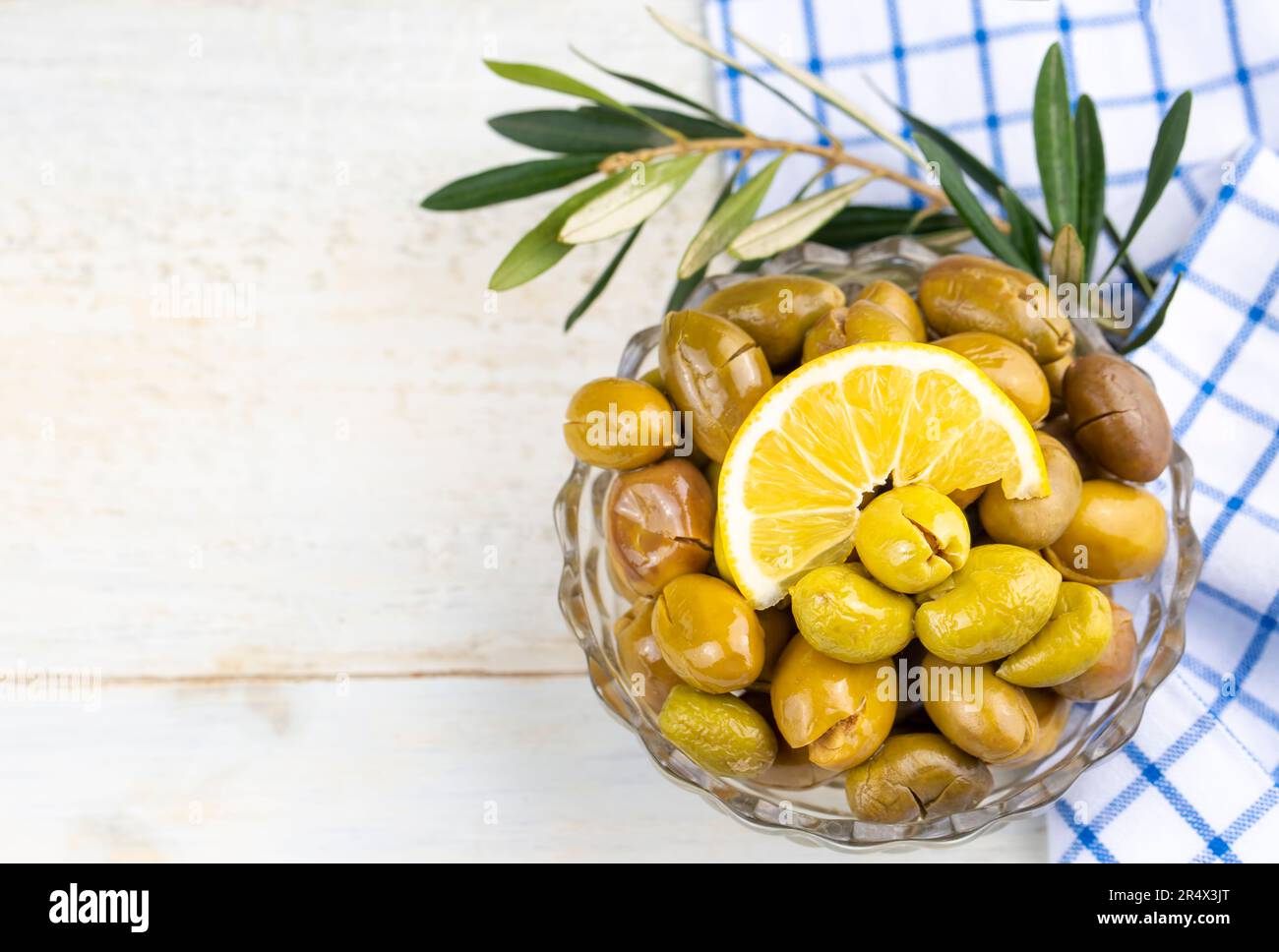 Cracked green olives. Cracked green olives with lemon. Turkish style