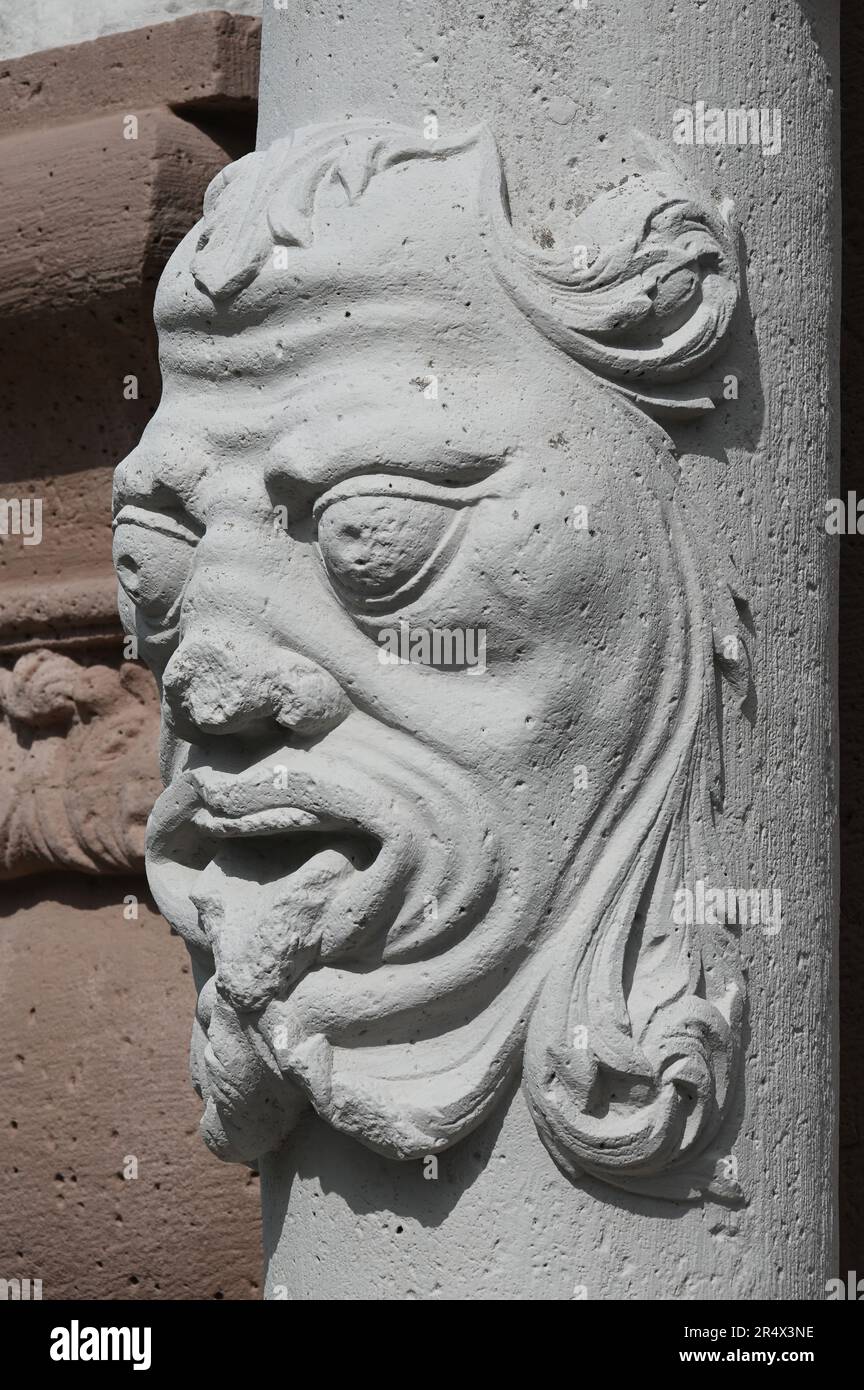 Baroque column with grimace face Stock Photo