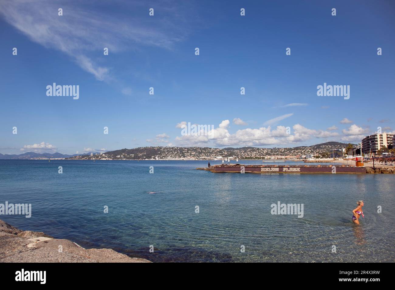 France, Provence-Alps, Cote d'Azur, Antibes Juan-les-Pins, Beach with tourists sunbathing and swimming in the sea. Stock Photo
