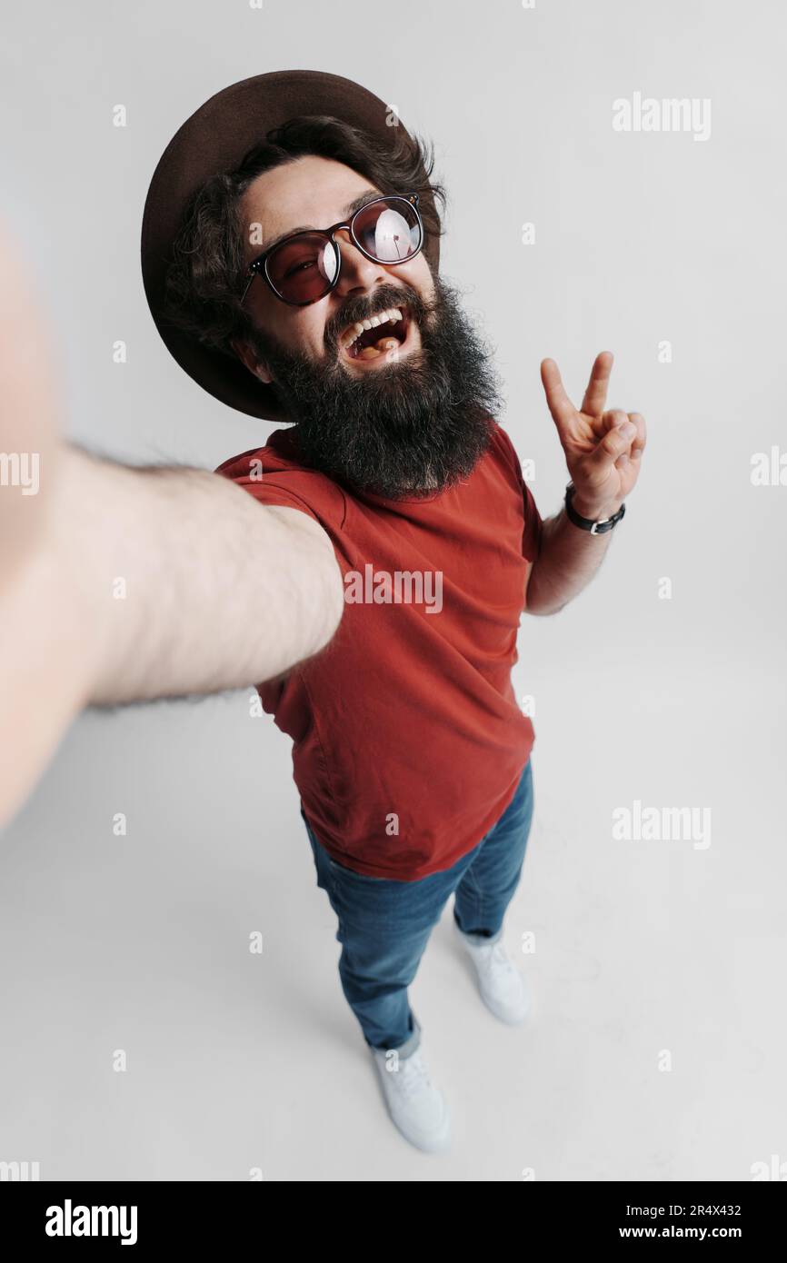 Handsome bearded man taking selfie Stock Photo