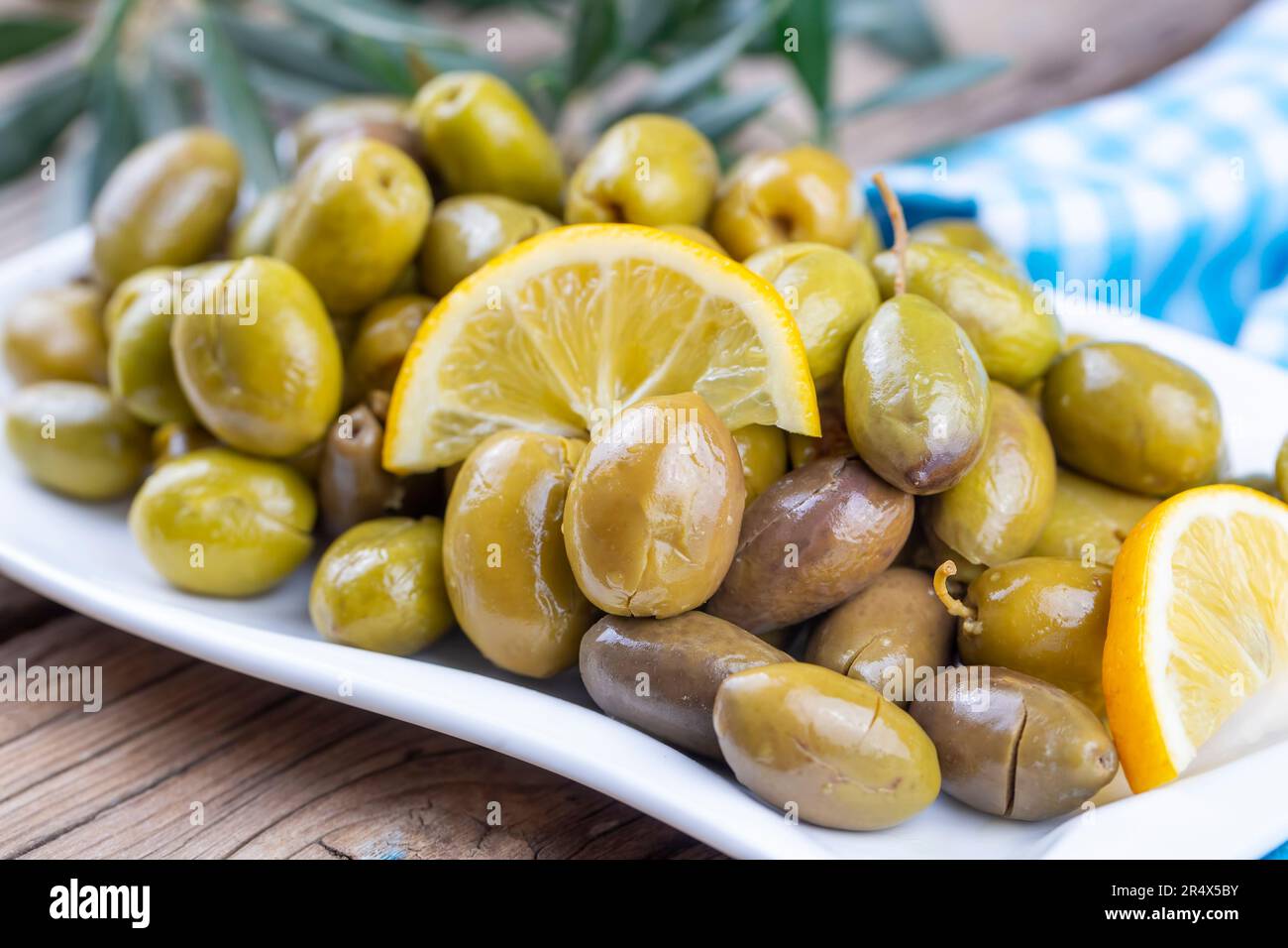 Cracked green olives. Cracked green olives with lemon. Turkish style