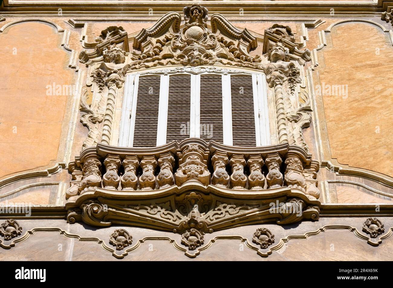 Valencia, Spain - July 15, 2022:  Old window and balcony. Exterior architecture of the Palace of the Marques de Dos Aguas in Valencia, Spain Stock Photo