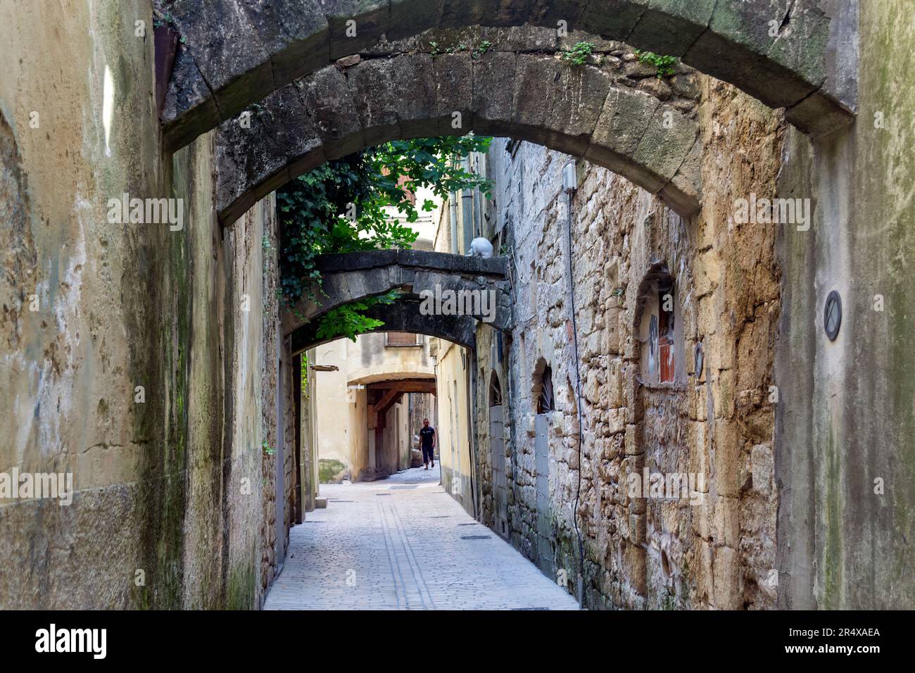 SOMMIERES, FRANCE - JULY 14th, 2018: View of a paved street in Sommières, Occitanie, South of France Stock Photo