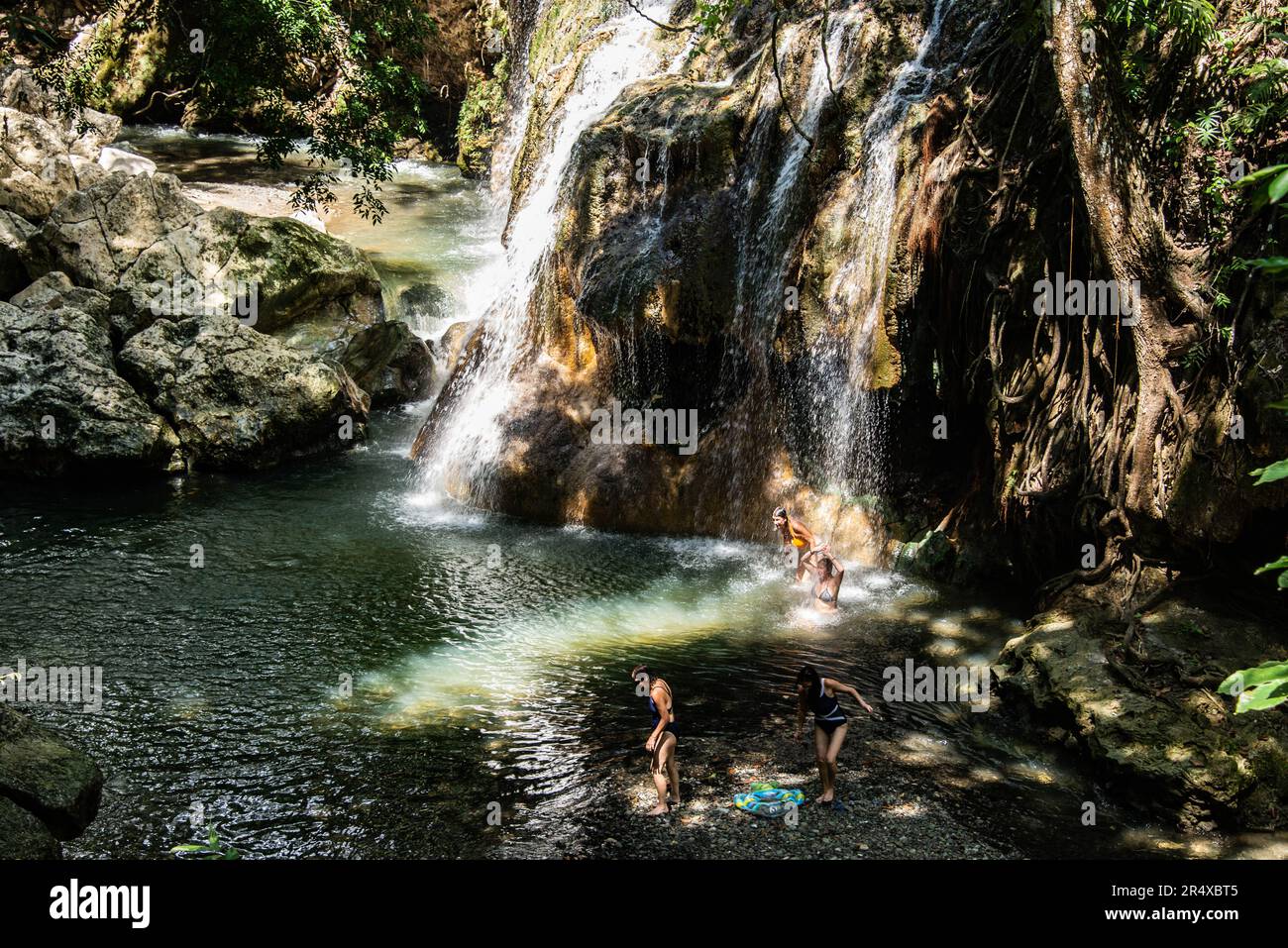 Enjoying the hot spring waterfall of Finca Paraiso, Rio Dulce ...