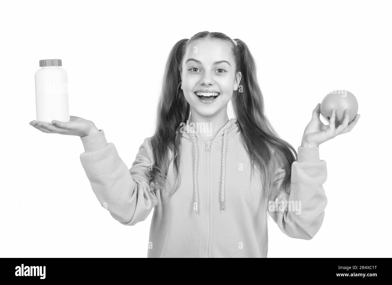 happy girl presenting multivitamin. organic food supplement. choice