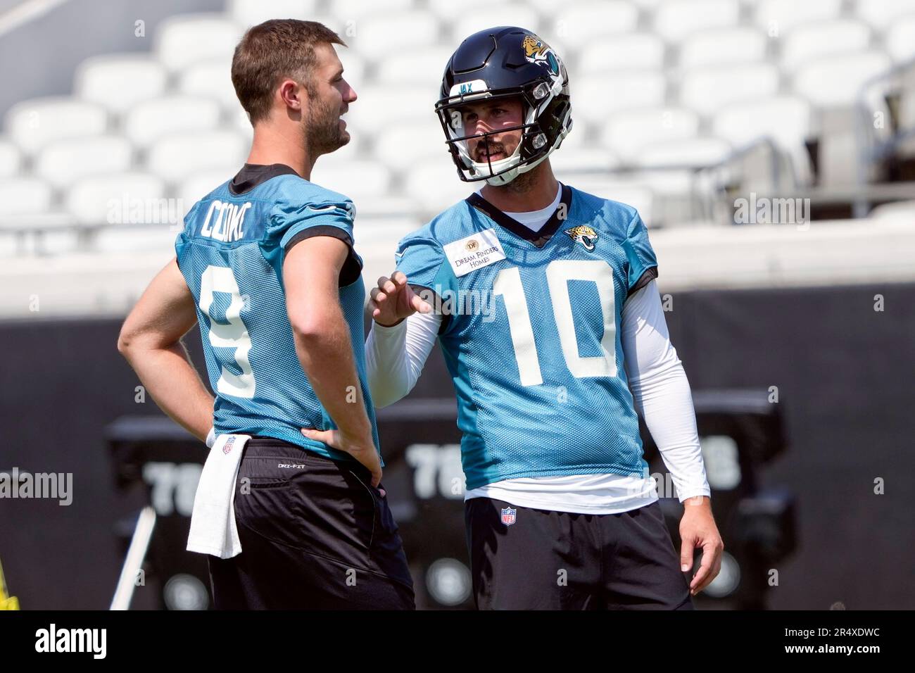 Jacksonville Jaguars kicker Brandon McManus (10) talks with punter