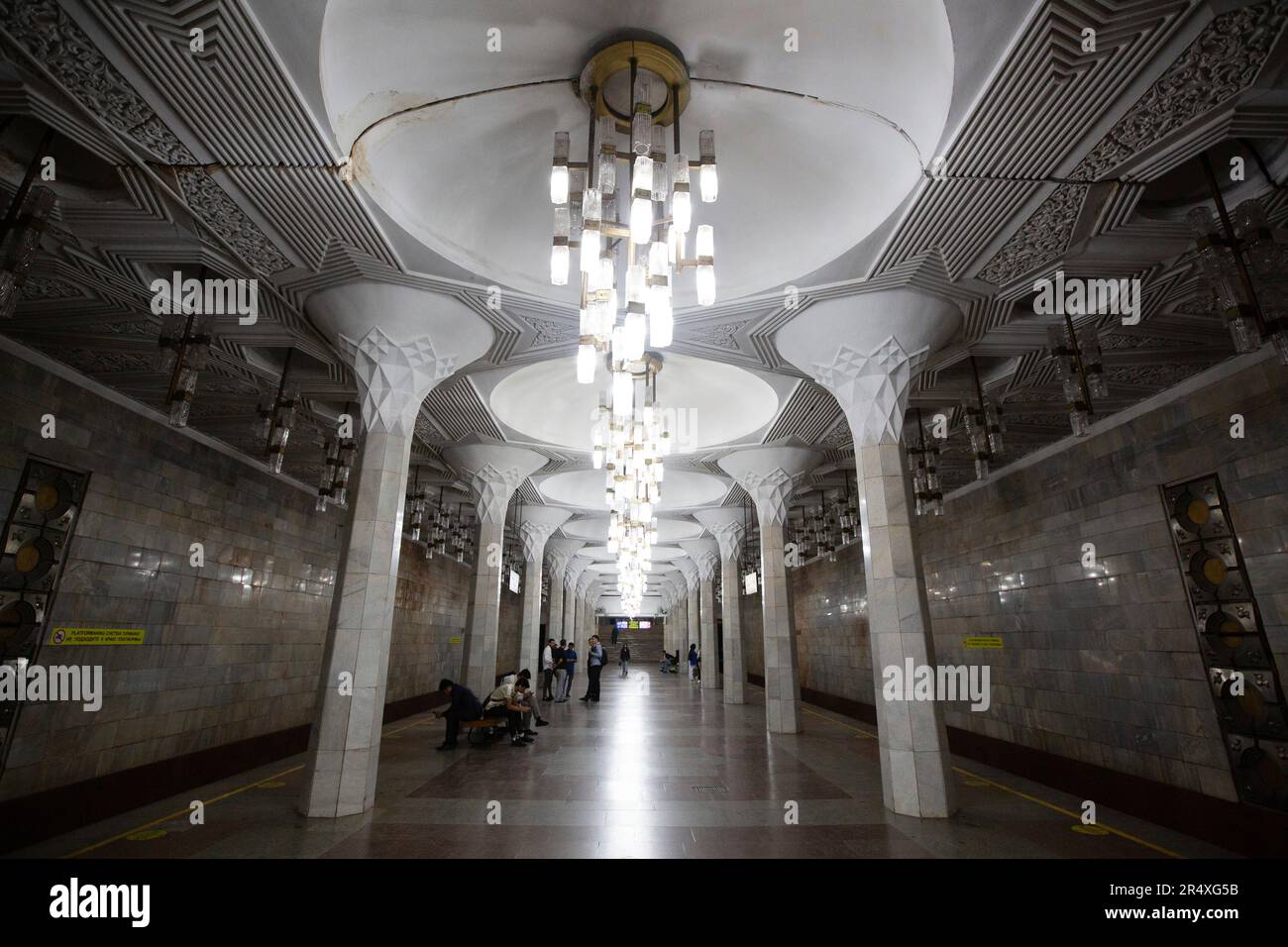 Decorative light fixtures at the ornate train platform of Mustakillik Station for the Tashkent Metro in Uzbekistan; Tashkent, Uzbekistan Stock Photo