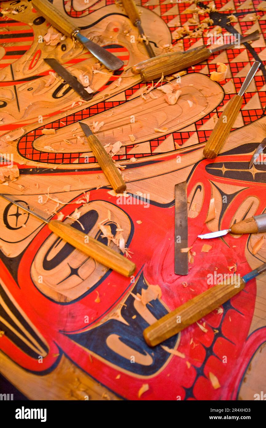 Tlingit painted panel and wood carving tools in Saxman Totem Park ...