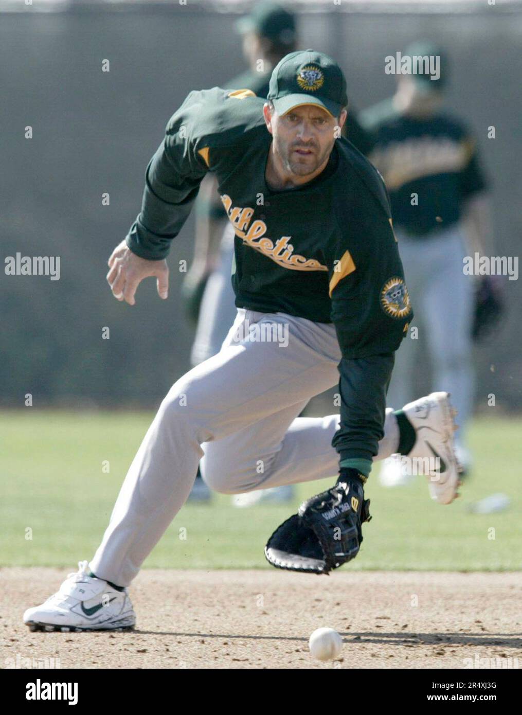 athletics27 466 pc.JPG Eric Karros took grounders at first base during an  infield drill. The Oakland Athletics held its first full-squad workout on  2/26/04 in Phoenix, AZ. PAUL CHINN / The Chronicle (