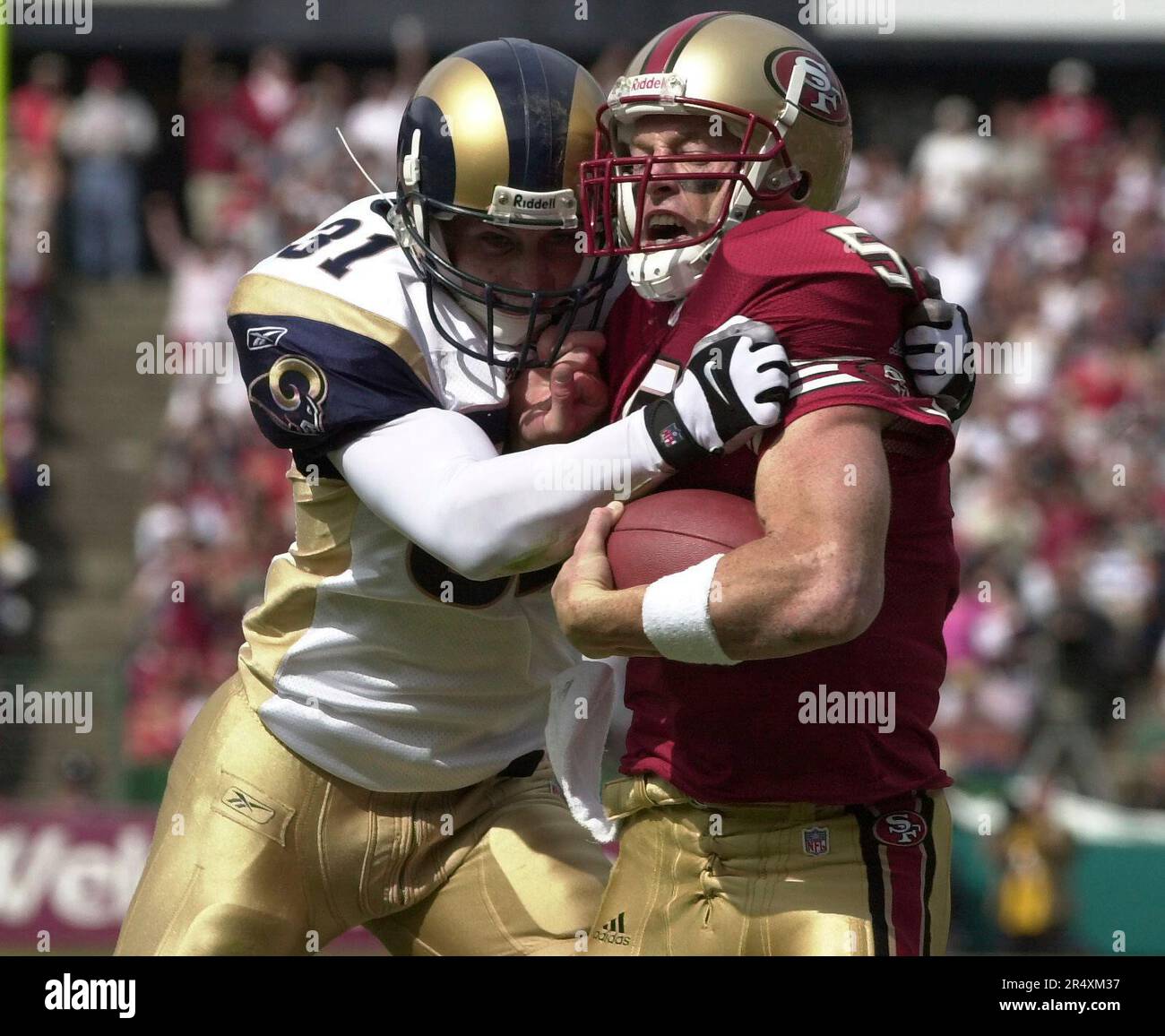 September 23, 2001 - San Francisco, California, U.S - St. Louis Rams  running back Marshall Faulk (28) hands ball off for reverse play on Sunday,  September 23, 2001, in San Francisco, California.