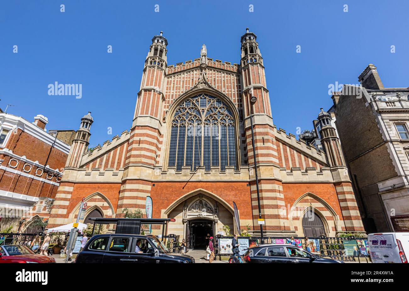 The front elevation of the iconic Gothic Revival architecture Holy Trinity Sloane Square church in Upper Chelsea, London SW1 on a sunny day, blue sky Stock Photo