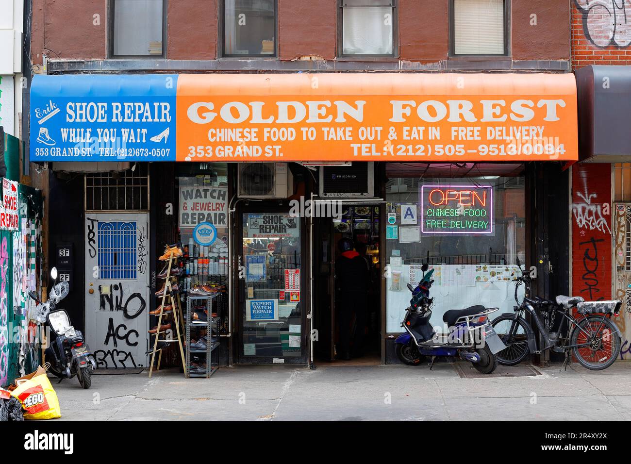 Erik Shoe Repair, Golden Forest, 353 Grand St, New York, NYC storefront photo of a shoe repair, and Chinese takeout restaurant in the Lower East Side. Stock Photo