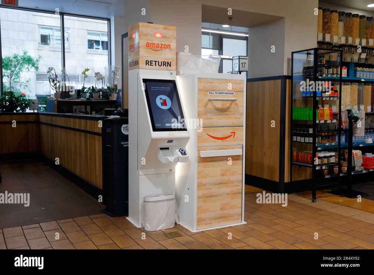 An automated Amazon Return kiosk at a Whole Foods Market for dropping off returns of items purchased from the online retailer. Stock Photo