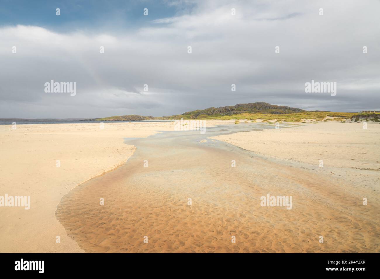 Seascape at low tide along the sandy beach of Reef Beach on the Isle of Lewis and Harris in the Outer Hebrides of Scotland, UK. Stock Photo
