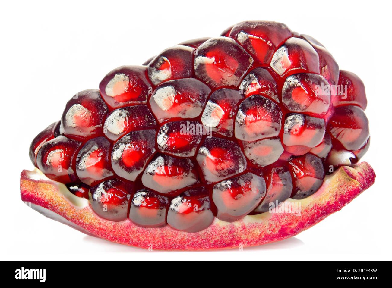 Shiny pomegranate slice isolated on white background Stock Photo