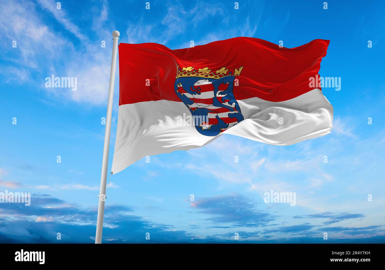 flag of German peoples Hessians at cloudy sky background, panoramic view. flag representing ethnic group or culture, regional authorities. copy space Stock Photo