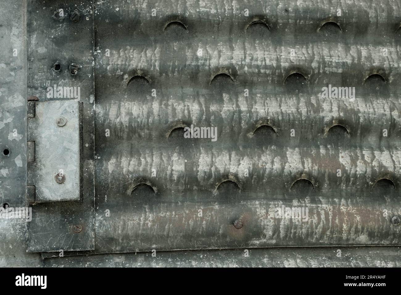 Shiny hinge on rusting, galvanised metal structure Stock Photo Alamy