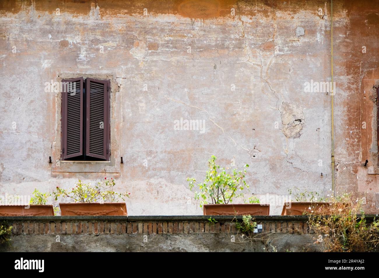 Shuttered window and aged wall with ledge in Rom, Italy Stock Photo - Alamy