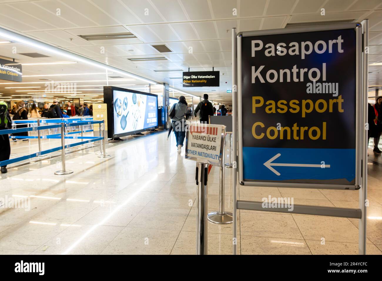 Passport control sign and direction signs, arrivals at Sabiha Gokcen International Airport, Istanbul, Turkey Stock Photo