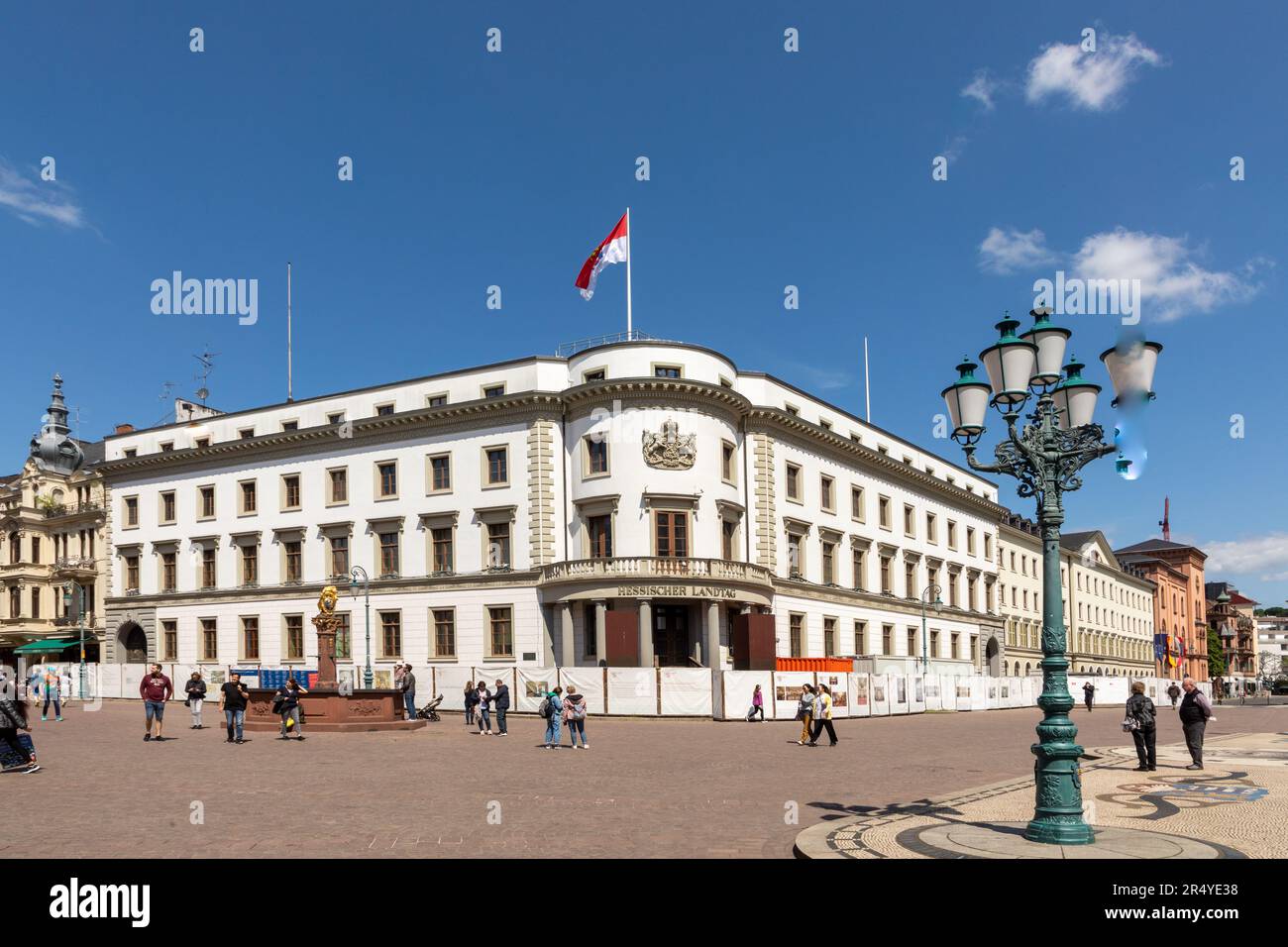 Wiesbaden, Germany - May 18, 2023: people visit the castle square at the  hessian parliament in the old historic white castle Stock Photo - Alamy