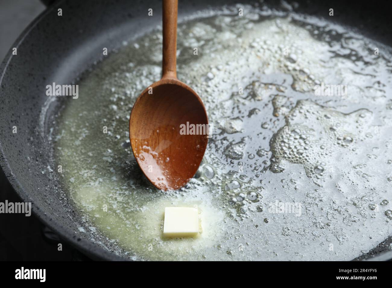 Melting butter in frying pan, closeup view Stock Photo Alamy