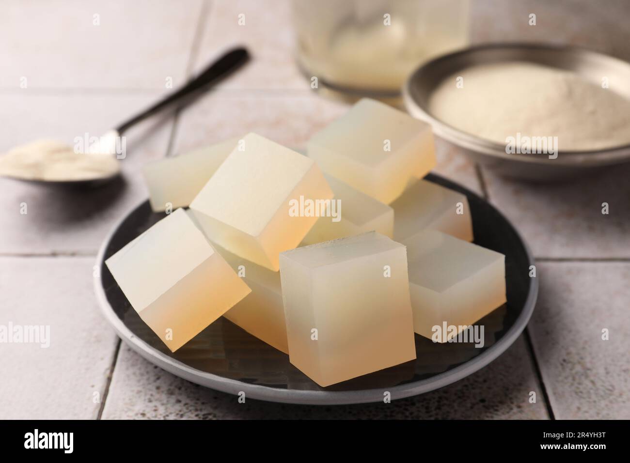 Agaragar jelly cubes on tiled surface, closeup Stock Photo Alamy