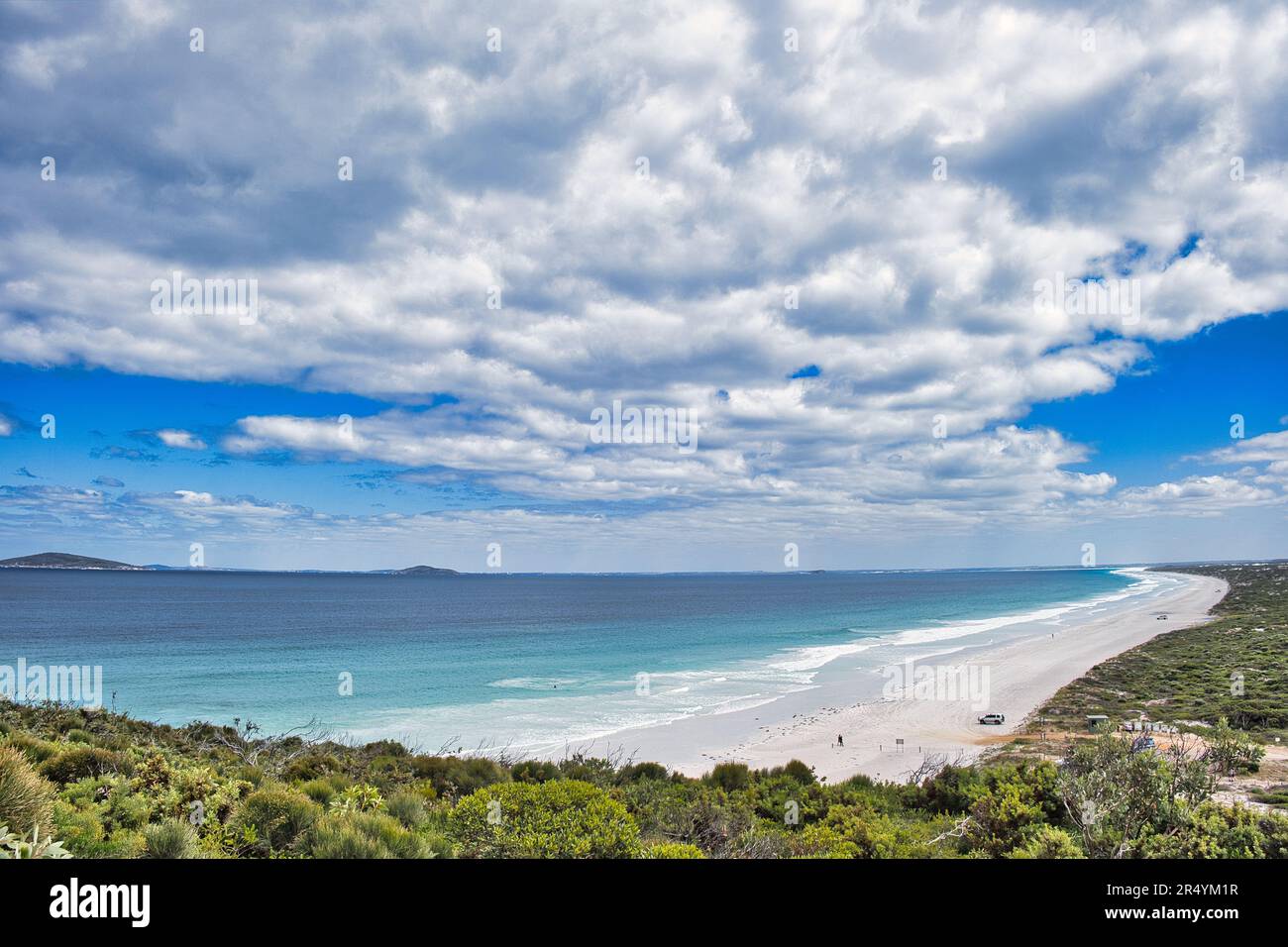 Clouds mirror the vast of Le Grand Beach, Cape Le Grand National Park, Western Australia. In the background islands of the Recherche Archipelago Stock Photo