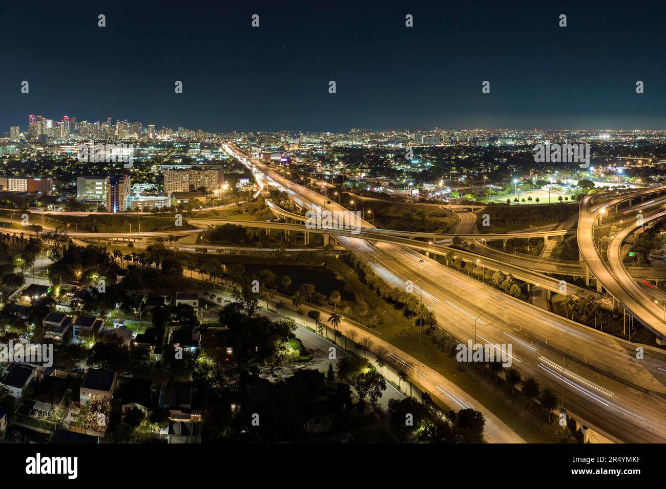 Aerial view of american highway junction at night with fast driving ...