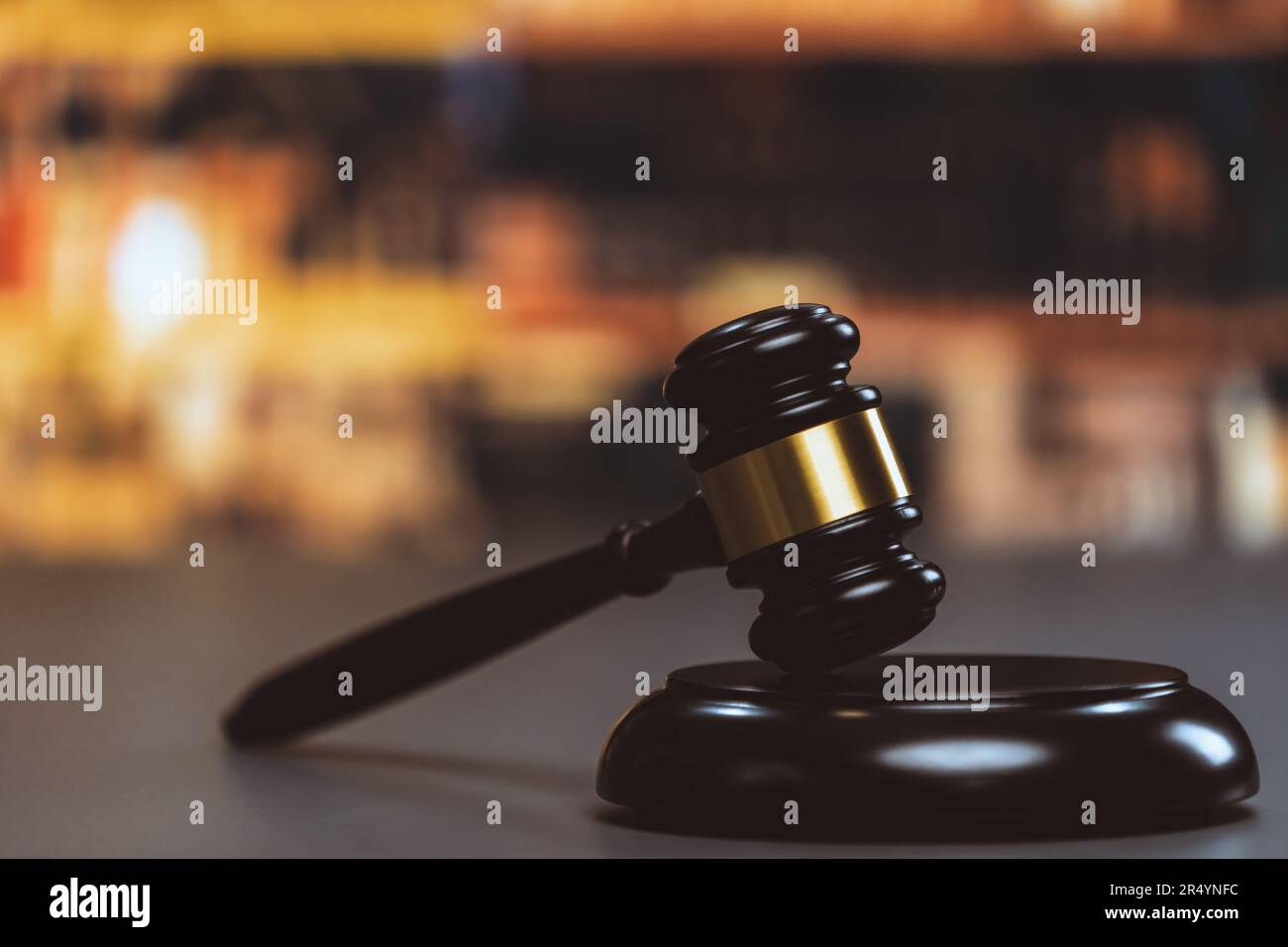 Black wooden gavel hammer on law firm or lawyer office background as