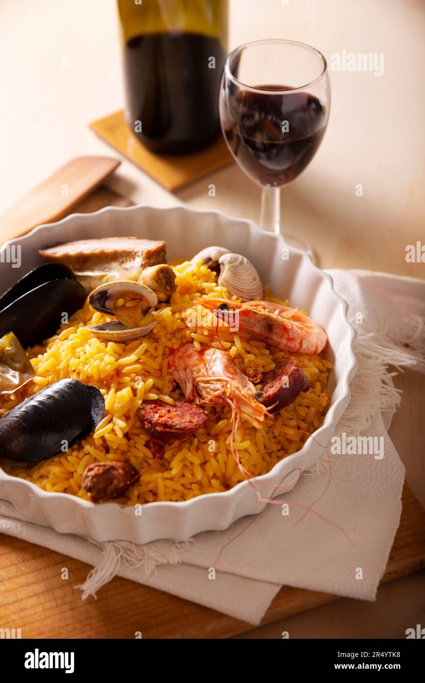 Paella. Typical Spanish dish, traditional recipe also known as paella rice. There are many accepted versions of this dish that is saffron rice cooked Stock Photo