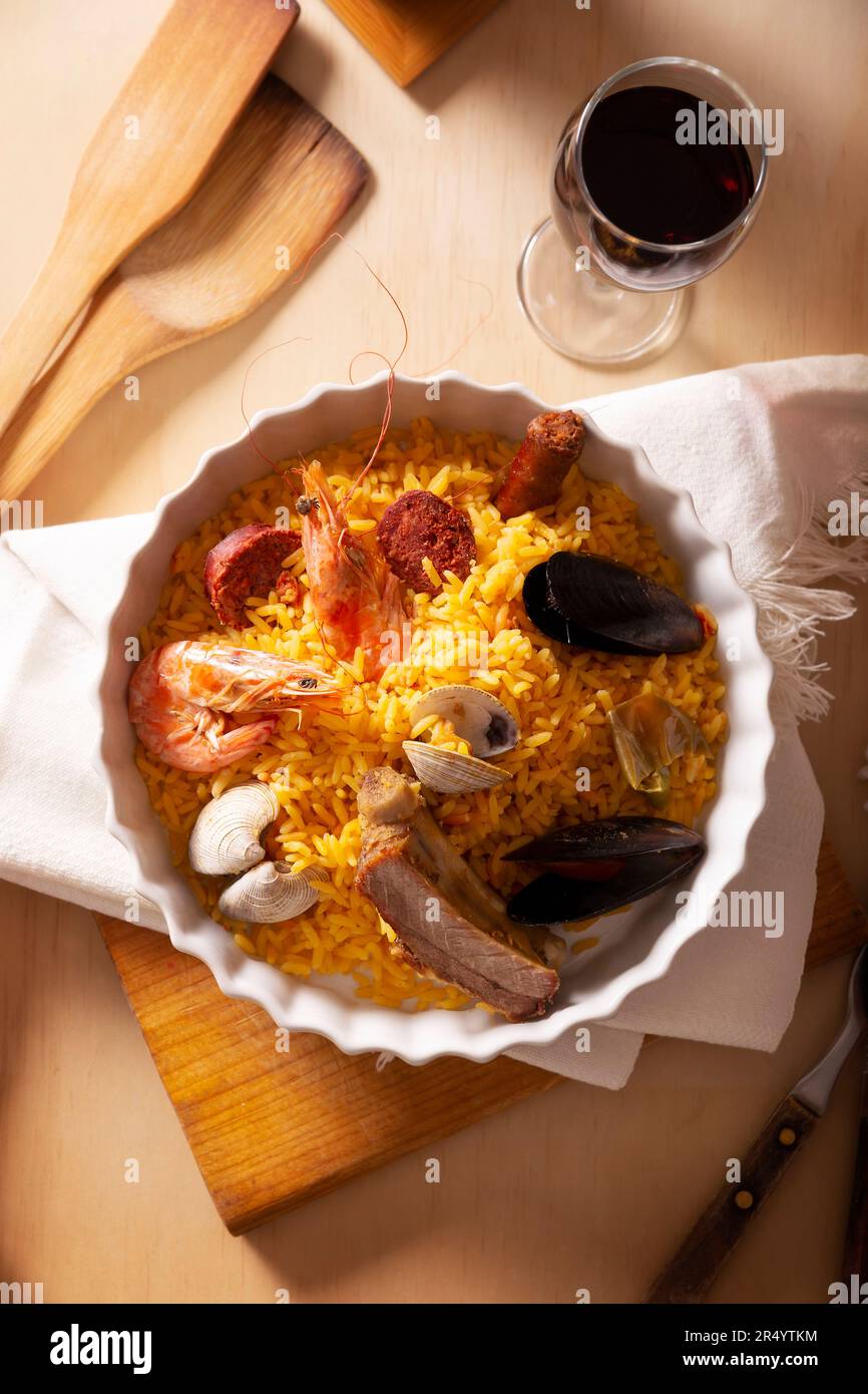 Paella. Typical Spanish dish, traditional recipe also known as paella rice. There are many accepted versions of this dish that is saffron rice cooked Stock Photo