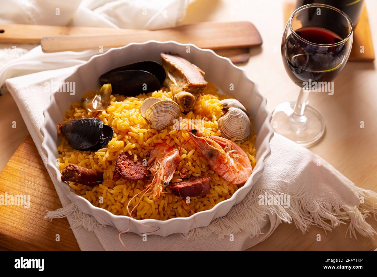Paella. Typical Spanish dish, traditional recipe also known as paella rice. There are many accepted versions of this dish that is saffron rice cooked Stock Photo