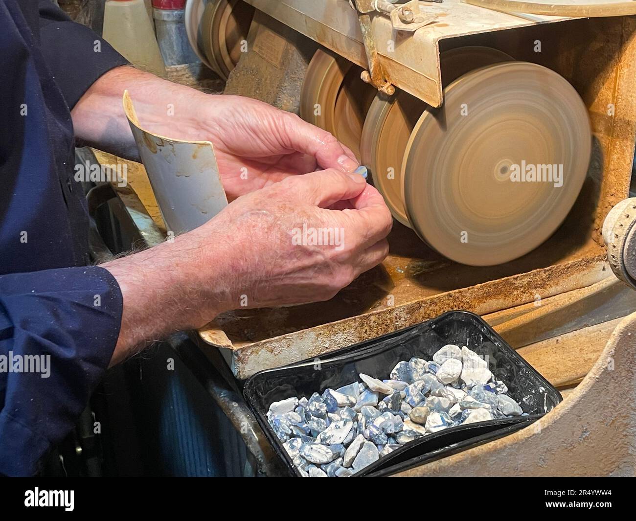 Sydney, Australia. 04th May, 2023. Opal prospector Robert Oberdorfer cuts a small opal stone at the National Opal Collection. (to dpa 'In the frenzy of opals: Australia's fascinating national gemstone') Credit: Michelle Ostwald/dpa/Alamy Live News Stock Photo