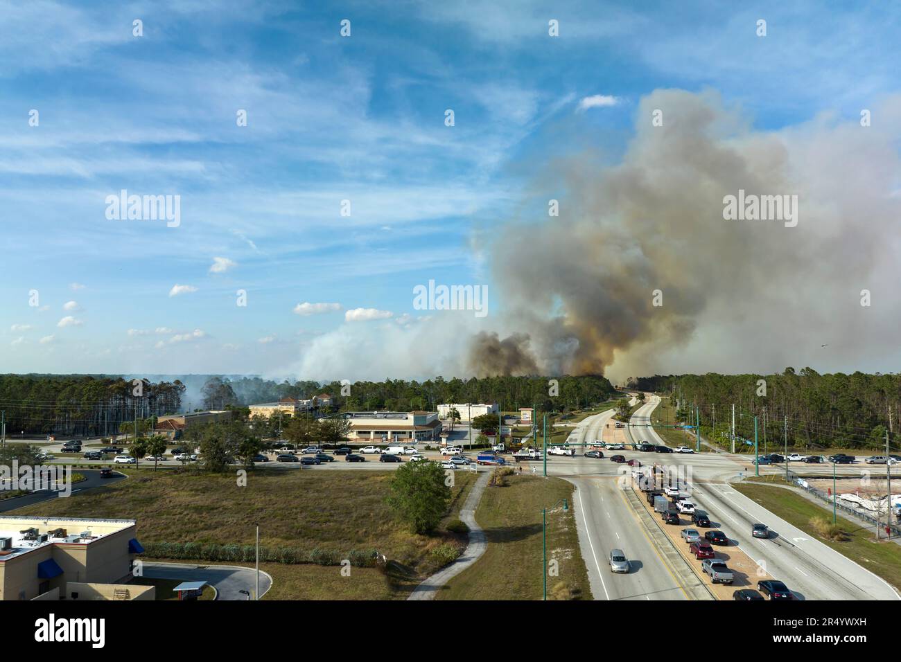 View from above of lagre wildfire burning severely in North Port city