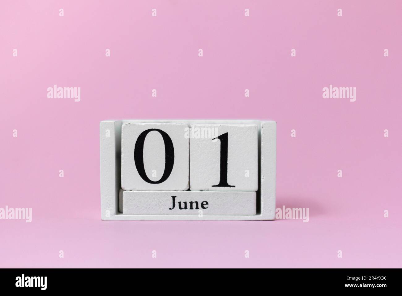 June 1 in the calendar on a pink background is the start date of the new month Stock Photo