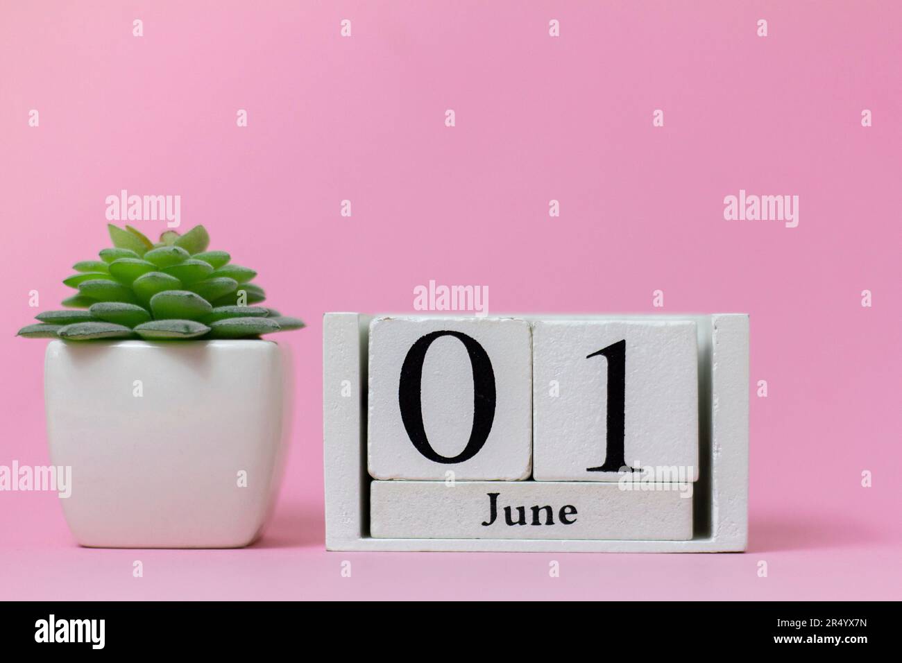 June 1 in the calendar on a pink background is the start date of the new month Stock Photo