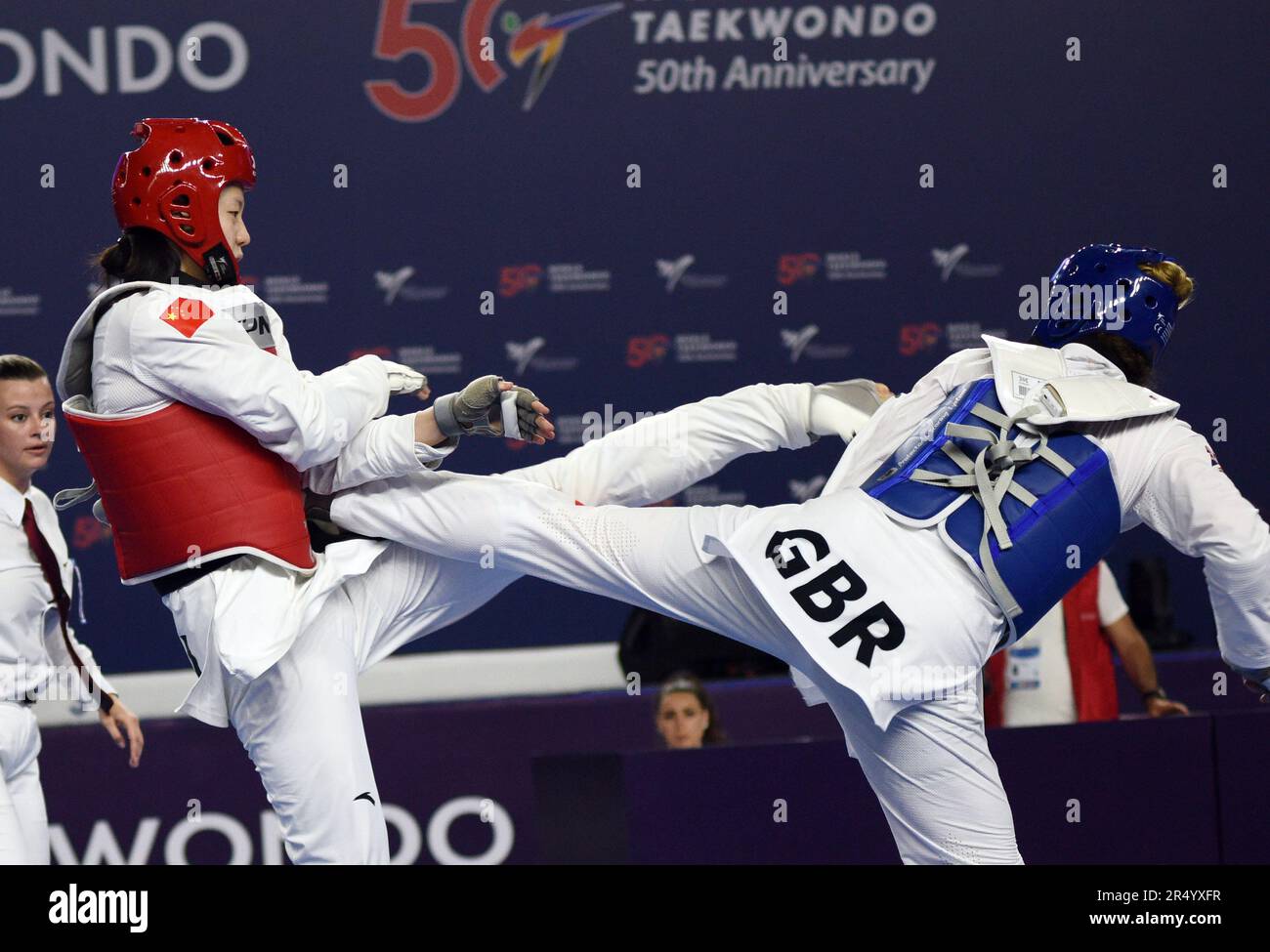 Baku, Azerbaijan. 30th May, 2023. Song Jie (L) of China competes with Rebecca Mcgowan of Britain during the women's 73kg round of 32 match at the World Taekwondo Championships 2023 in Baku, Azerbaijan, May 30, 2023. Credit: Tofiq Babayev/Xinhua/Alamy Live News Stock Photo