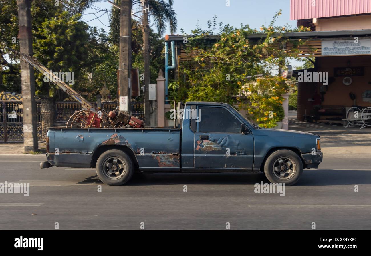 The pick up drives an agricultural machine, Thailand Stock Photo