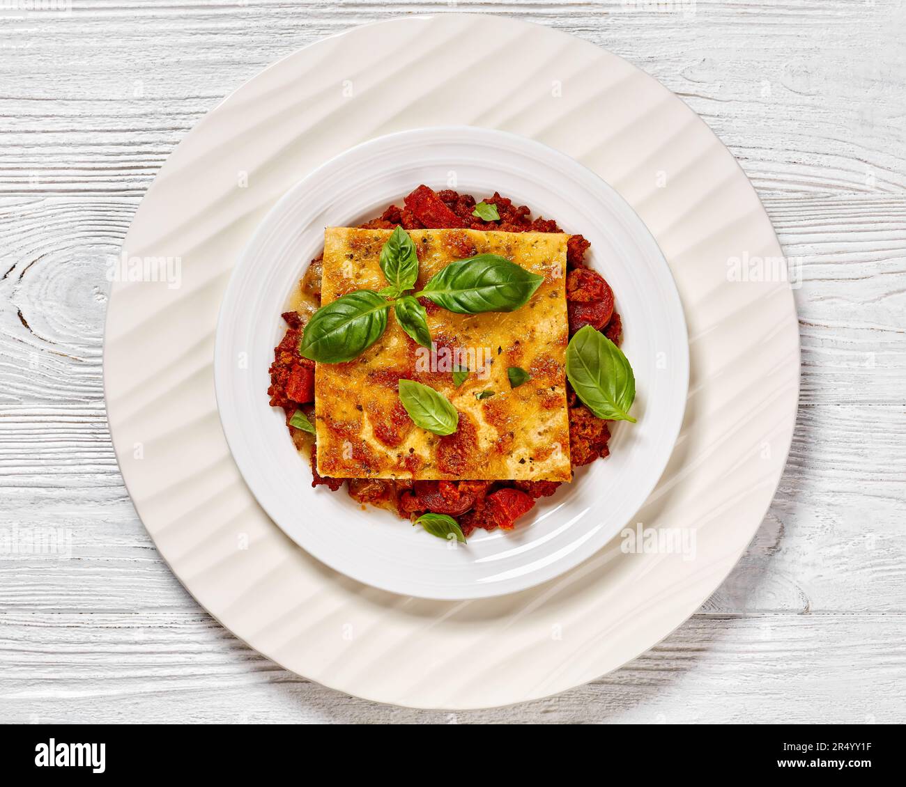 portion of upside down pizza of chorizo sausages, tomato sauce