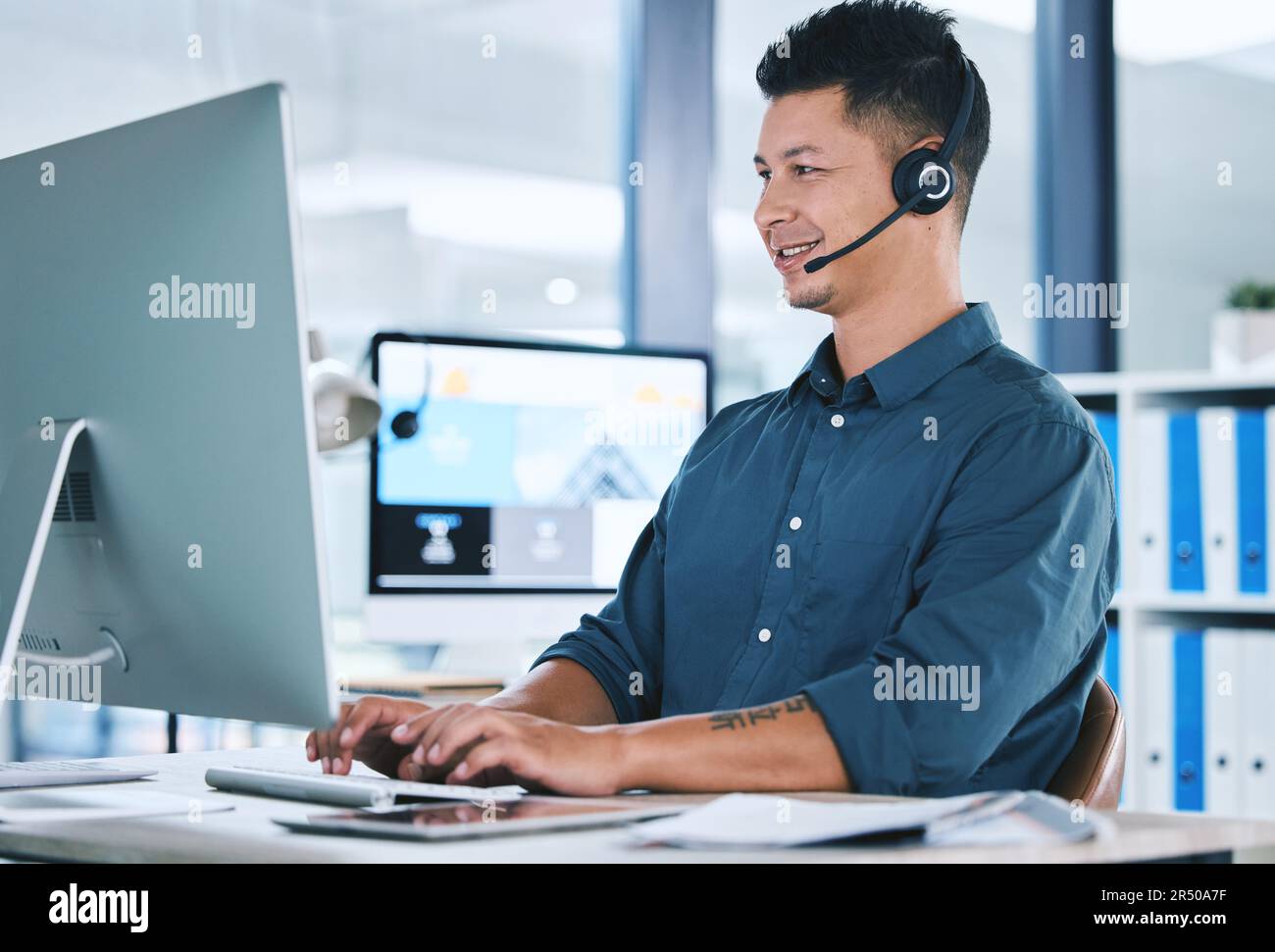 Call center, customer service and a man typing on computer with a