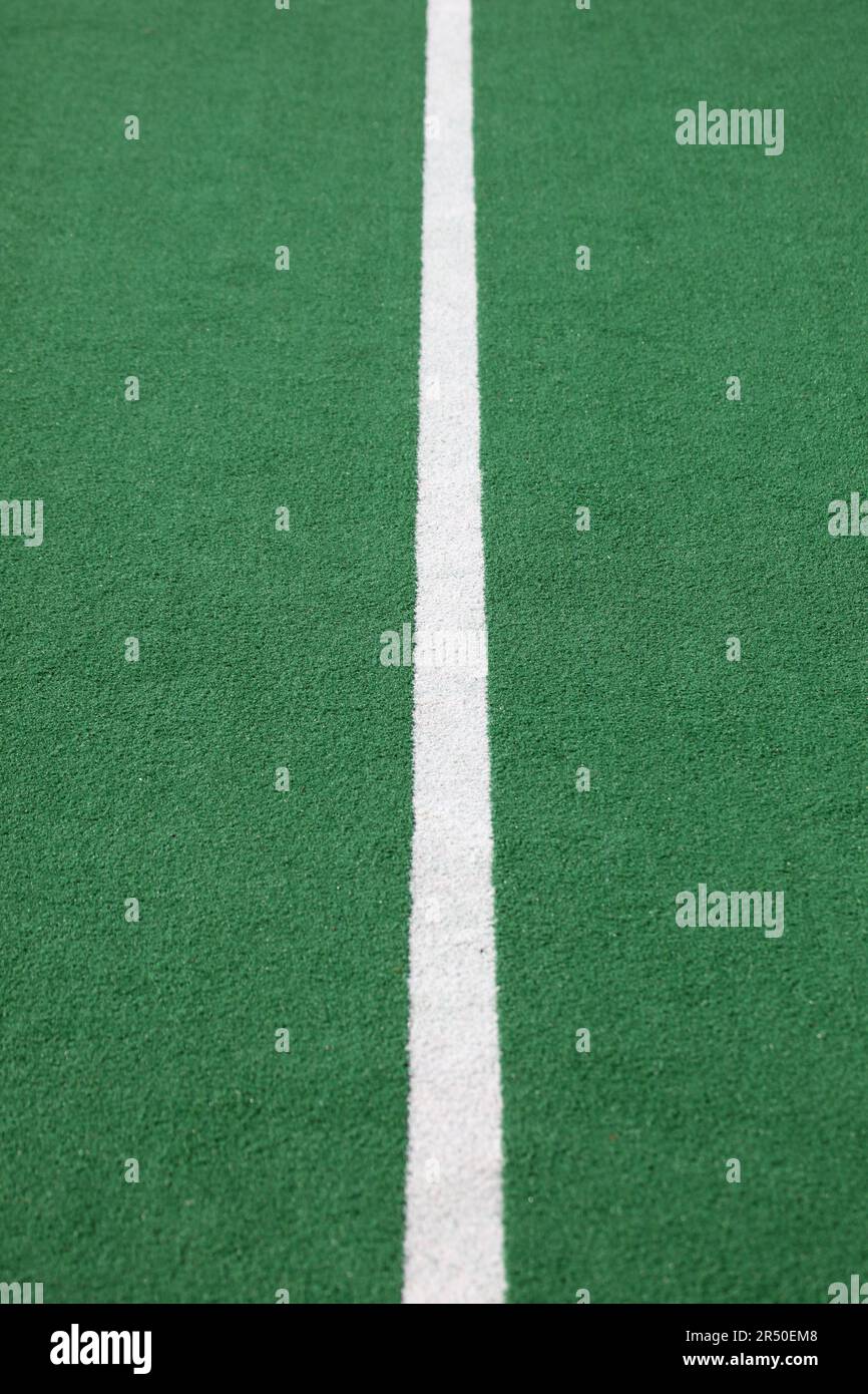 Closeup of the halfway line on a synthetic hockey field Stock Photo