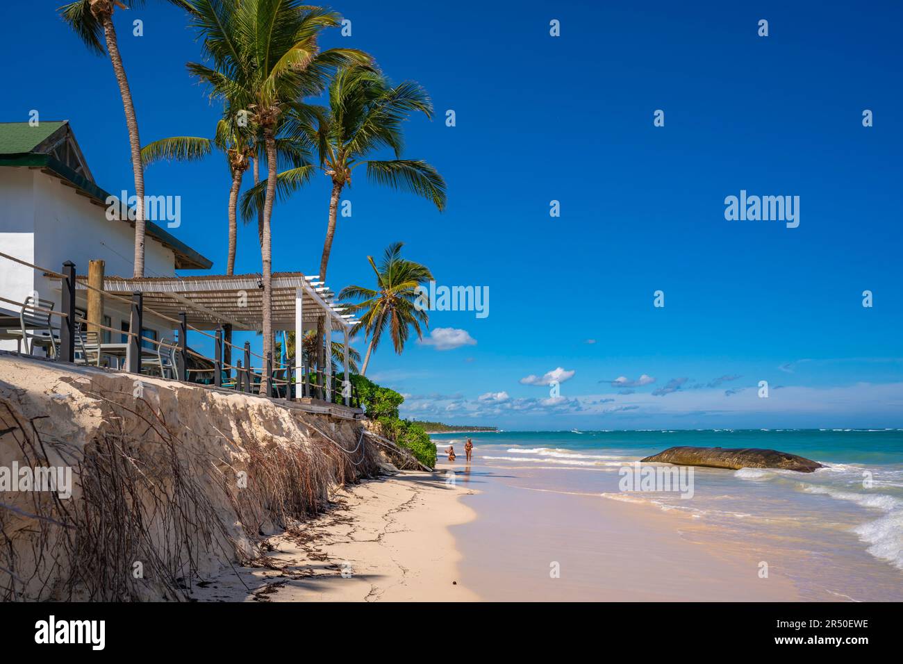 View of palm trees and cafe at Bavaro Beach, Punta Cana, Dominican Republic, West Indies, Caribbean, Central America Stock Photo