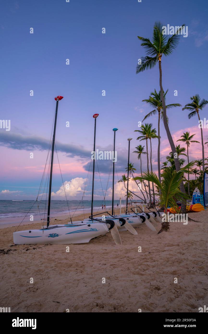 View of palm trees and sea at Bavaro Beach at sunset, Punta Cana, Dominican Republic, West Indies, Caribbean, Central America Stock Photo