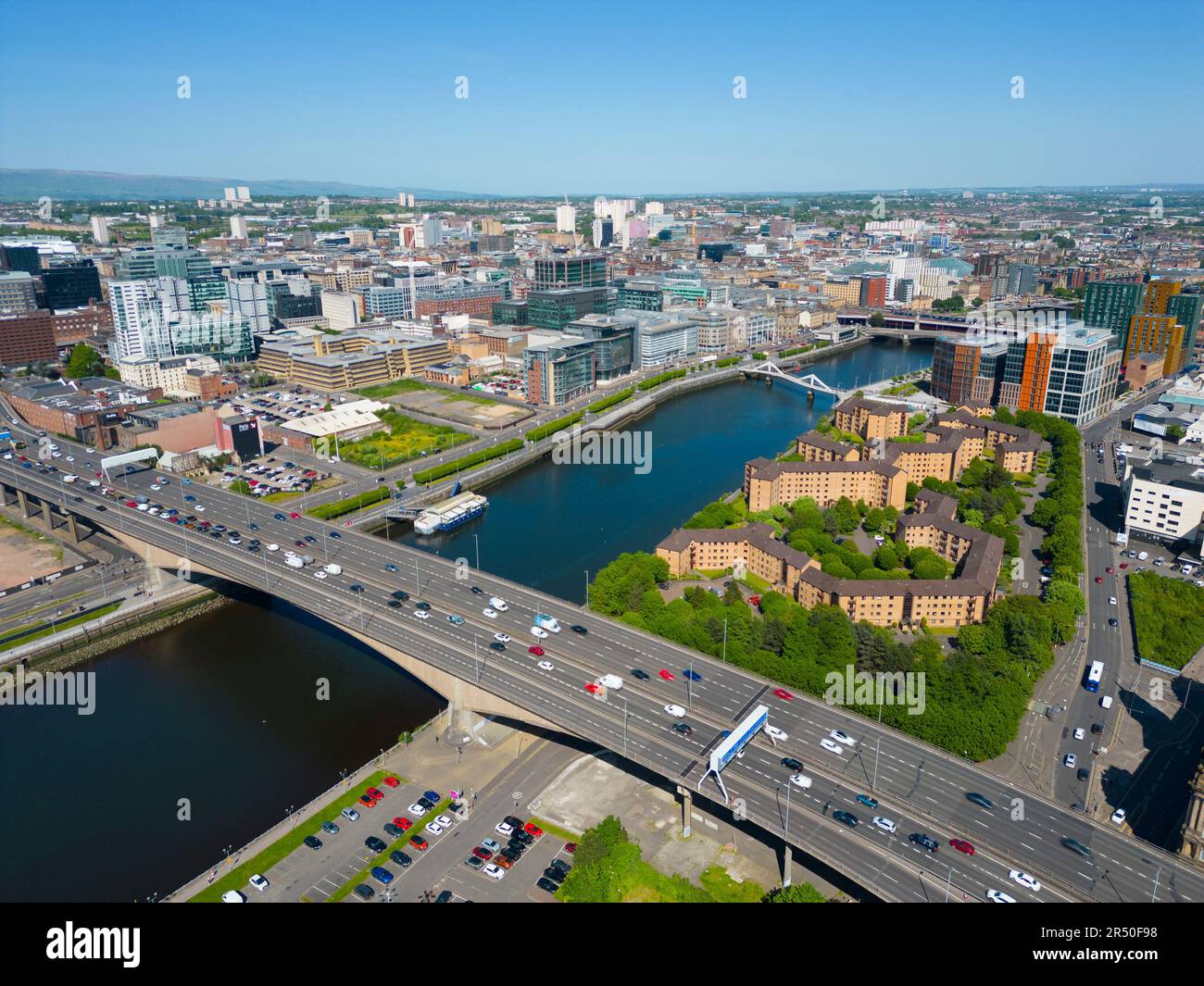 Aerial view from drone of Glasgow city centre skyline along River Clyde